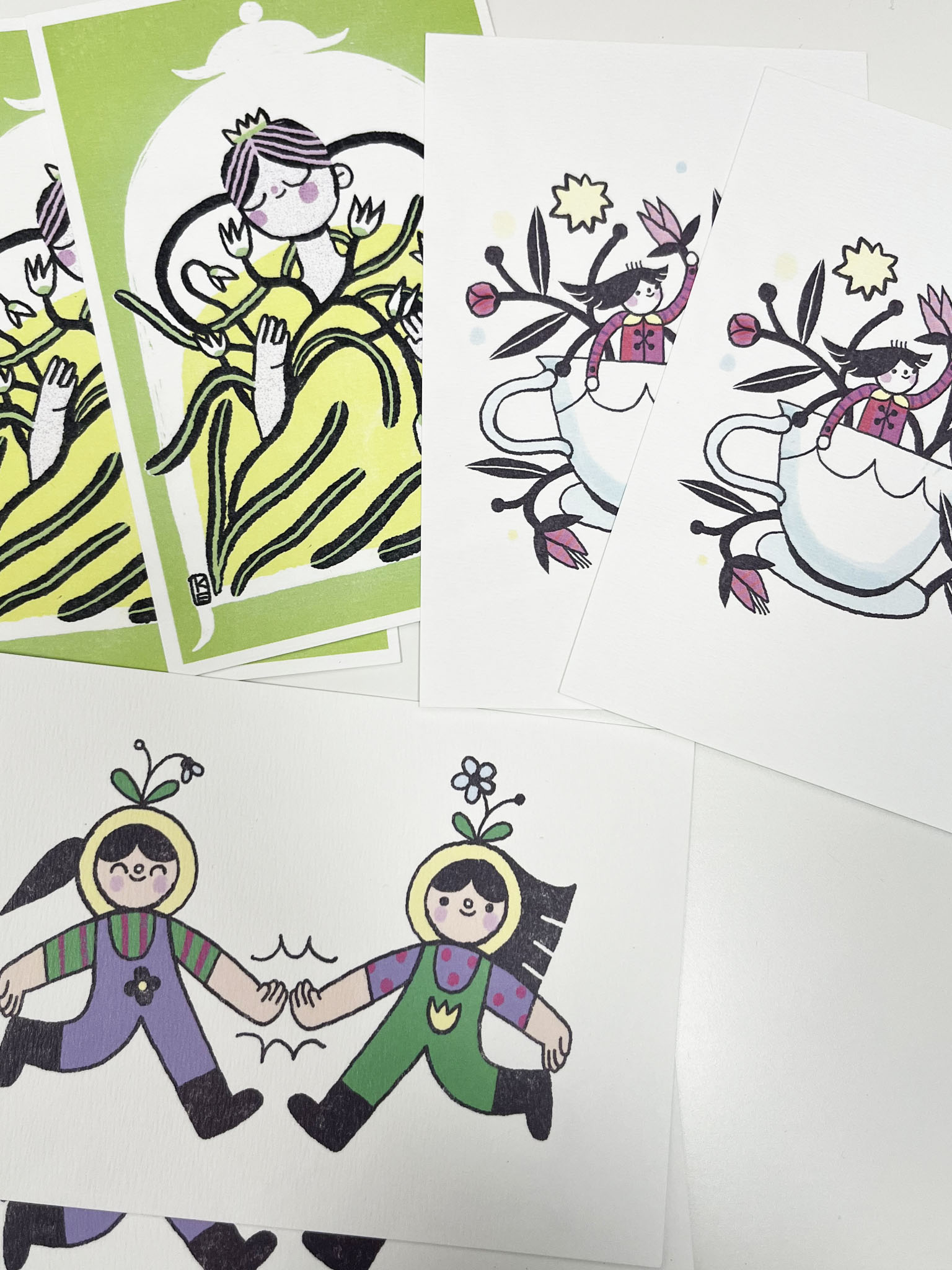 Various postcard designs in print